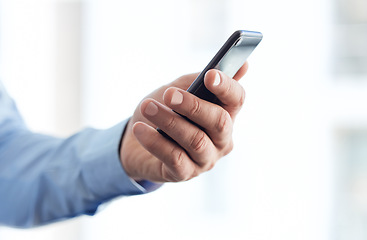 Image showing Making connections is easier now. an unrecognizable businessperson using a phone at work.