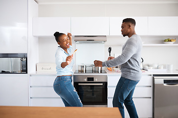 Image showing Nothing but good vibes. a young couple dancing at home.