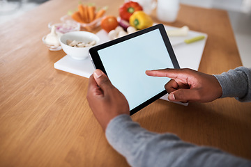 Image showing Cant cook The internet can help. an unrecognizable man using a digital tablet while cooking at home.