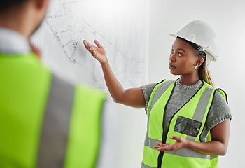 Image showing Theres so much planning to do. two architects planning in an office at work.