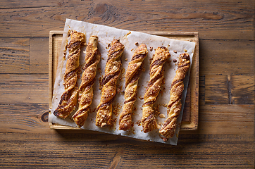 Image showing freshly baked pastries with chocolate cream and almonds