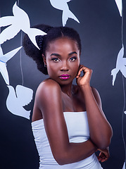 Image showing I woke up and decided to be a goddess. Studio portrait of a beautiful young woman posing with paper birds against a black background.