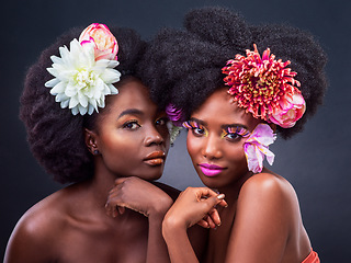 Image showing Flowers need time to bloom, so do you. two beautiful women posing together with flowers in their hair.