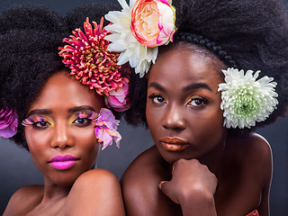 Image showing Flowers dont tell, they show. two beautiful women posing together with flowers in their hair.
