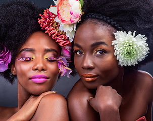 Image showing You dont need anything but flowers. two beautiful women posing together with flowers in their hair.