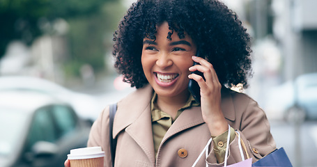 Image showing Happy woman, smile and phone for communication on street while walking, coffee cup and shopping bags. African person, curly hair and excitement for conversation on commute to work in city for meeting