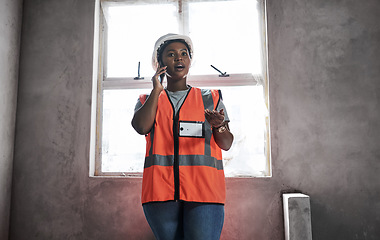 Image showing Your building is her business. a young woman using a smartphone while working at a construction site.