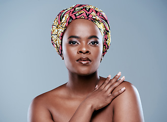 Image showing You cant keep a strong woman down. Studio portrait of a beautiful young woman posing against a grey background.