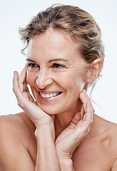Image showing Rise and shine with beautiful glowing skin. a beautiful mature woman posing against a white background.