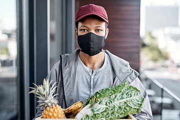 Image showing Theres never been a more important time to stay healthy. a young man delivering fresh produce to a place of residence.