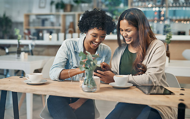 Image showing You should follow this funny vlogger. two friends looking at something on a cellphone while sitting together in a coffee shop.