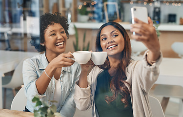 Image showing We always caffeine our way back to each other. two friends taking a selfie while sitting together in a coffee shop.