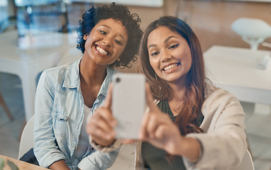 Image showing Some connections are stronger than others. two friends taking a selfie while sitting together in a coffee shop.