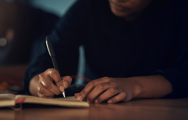 Image showing Whatever the tech problem, she’ll make a plan. an unrecognisable technician writing in a notebook while repairing computer hardware.