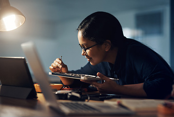 Image showing She doesn’t give up until it gets fixed. a young technician using a screwdriver to repair computer hardware.