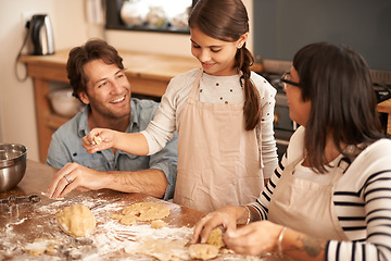 Image showing These are gonna be the best cookies ever. a family having fun baking in a kitchen.