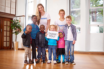 Image showing Bring smiles to their faces is the best reward. volunteers working with little children.