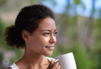 Image showing Waking up made easy with a warm drink. a young woman enjoying a cup of coffee.