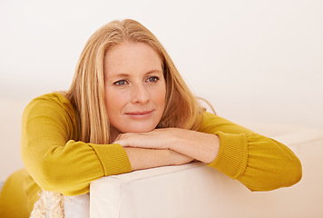 Image showing Taking time out from a busy day. a woman relaxing on a couch.