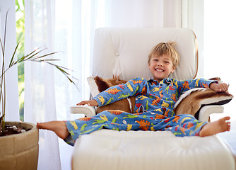 Image showing Ultimate relaxation. Portrait of an adorable little boy relaxing on the couch at home.