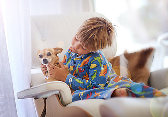 Image showing Its just you and me buddy. A little boy petting his dog on the couch.