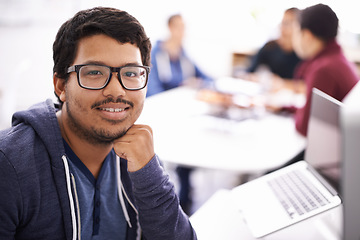 Image showing Ill get the job done. a young man working on his laptop in an office.