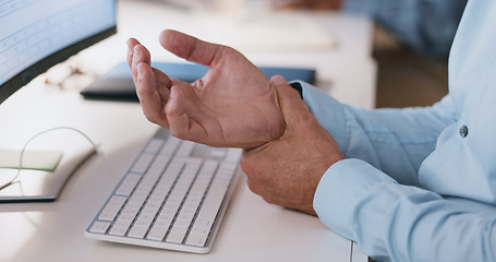 Image showing Businessman, hands and wrist in joint pain from injury, overworked or carpal tunnel syndrome at office. Closeup of man or employee with arthritis, ache or inflammation of palm on desk at workplace