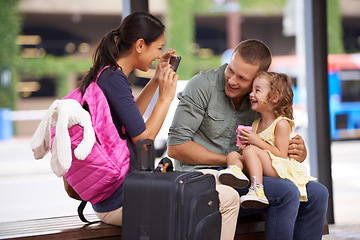 Image showing Daddys girl and mommys world. A family taking pictures at the beginning of their holiday.