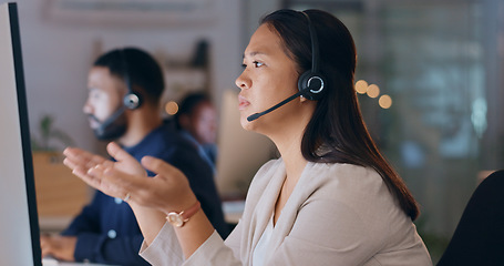 Image showing Business woman, call center and computer for night customer service, e commerce support and help in office. Professional consultant or Asian agent with website solution, questions or FAQ in workspace