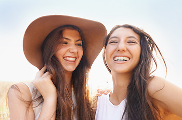 Image showing We not worried about tomorrow we only live for today. Two beautiful young friends spending time together in the sunshine.