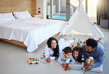 Image showing Theres nothing better. a young family using a digital tablet together at home.