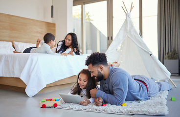 Image showing A family filled with love and joy. a young father and daughter using a digital tablet together at home.