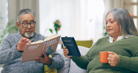 Image showing Reading, relax and senior couple on a sofa with book, tablet and coffee while bonding at home together. Literature, ebook and old people chilling with tea in a living room calm and enjoy retirement