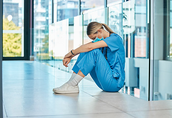 Image showing I cant get a break today. a young female doctor looking tired while working in a modern hospital.