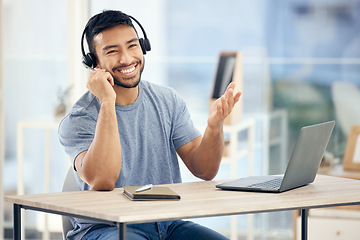 Image showing Hell advise you wisely. a young male call center agent working in an office.