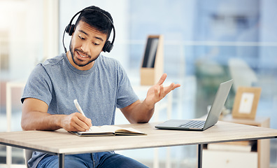 Image showing That could be a good idea. a young male call center agent working in an office.