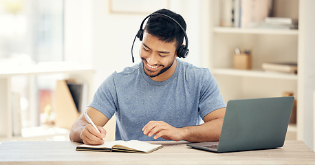 Image showing Every idea can become something great. a young male call center agent working in an office.