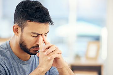 Image showing Where can I buy patience. a young businessman suffering from a headache at work.