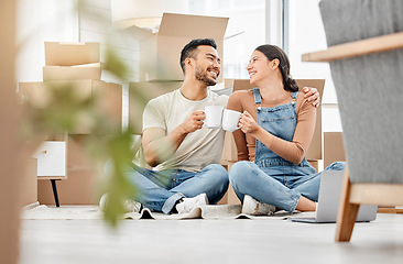 Image showing Im so lucky to be making this new start with you. a young couple sitting on the floor and drinking coffee while moving house.