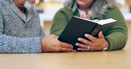Image showing Reading book, hands or old couple with bible in home for faith, religion or God with hope in house. Studying Jesus Christ, worship or senior Christian people learning literature or spiritual prayer