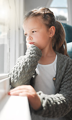 Image showing Look at all my friends playing. a young girl looking bored at home.