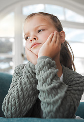 Image showing I just want to go outside. a young girl looking bored at home.