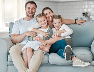 Image showing In family life, love is the oil that eases friction. a young family bonding together on a sofa at home.