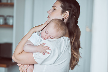 Image showing A heart so full. a beautiful young mother bonding with her newborn at home.