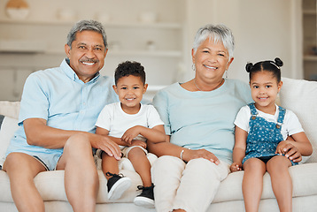 Image showing They are God’s gift to you. grandparents bonding with their grandchildren on a sofa at home.