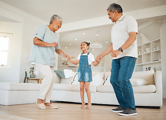 Image showing I am blessed to have so many great things. an adorable little girl bonding with her grandparents while dancing with them in the living room.
