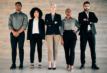 Image showing Dont be afraid to give your best. a group of businesspeople standing with their arms crossed in an office at work.