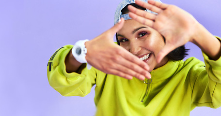 Image showing I know gorgeous when I see it. Studio shot of a beautiful young woman making a finger frame gesture against a purple background.