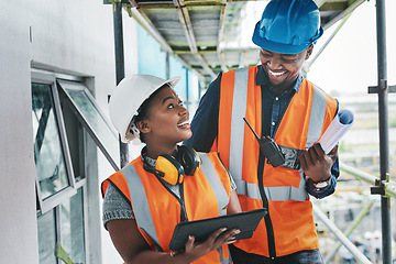 Image showing Putting smart systems in place to get the job done on time. a young man and woman using a digital tablet while working at a construction site.