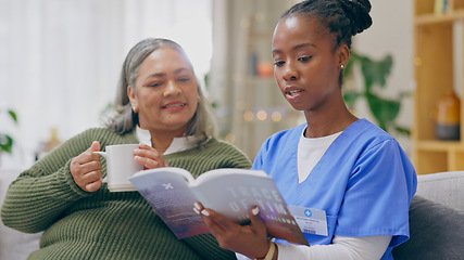 Image showing Coffee, reading book or senior patient with nurse on sofa for nursing home, retirement or house. Healthcare, tea or elderly lady with caregiver, black woman or volunteer in hospice for rehabilitation